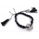 Bracelet fantaisie perles facettées noires, pompon